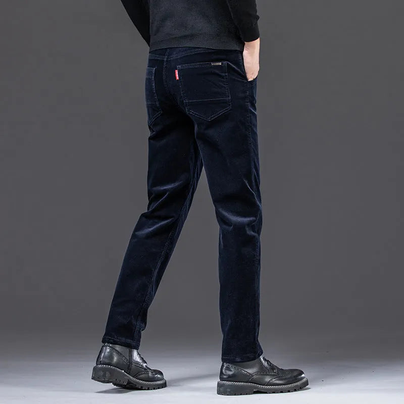 Men's straight slim-fit corduroy trousers in black, cotton fabric, side view on model