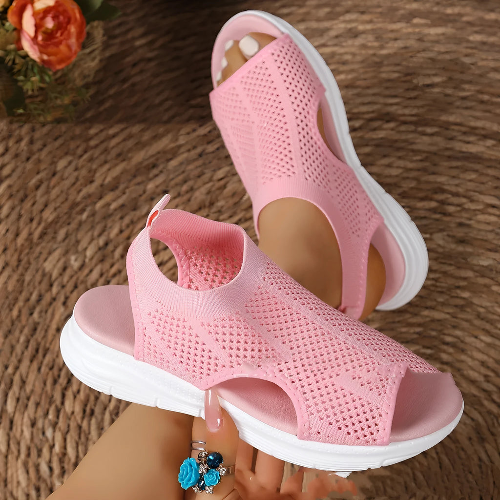 Women's flat platform sports sandals in black with a rubber sole and mesh lining.