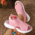 Women's flat platform sports sandals in black with a rubber sole and mesh lining.