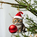Colourful cartoon kitty Christmas ornament hanging in a car interior.