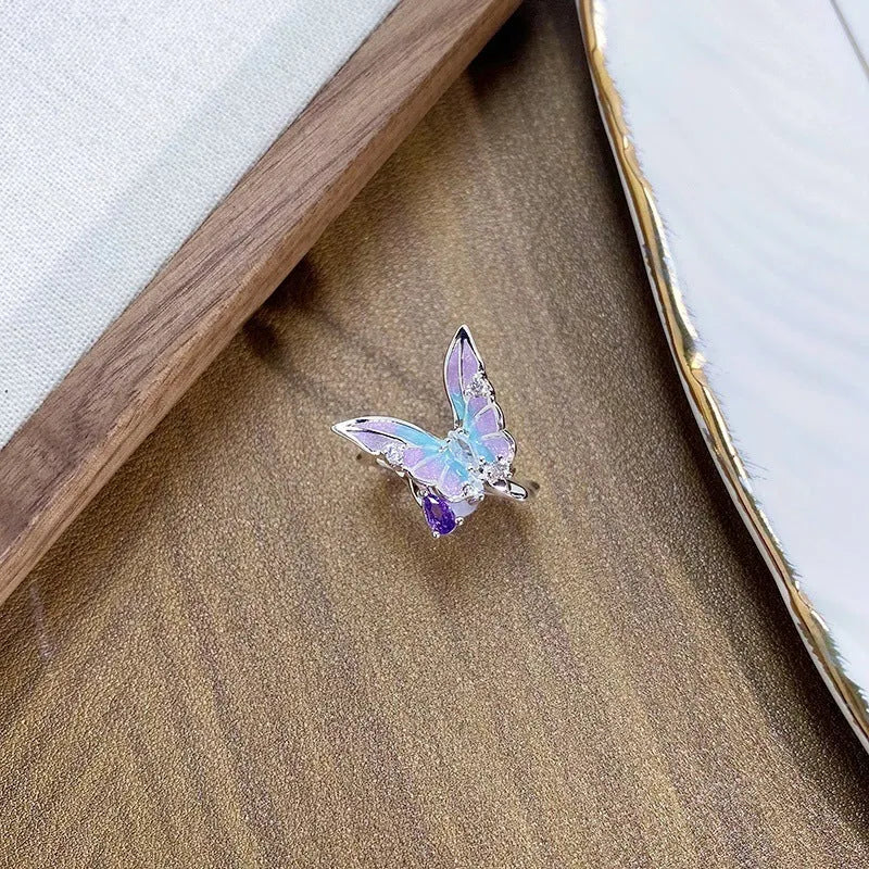 Adjustable copper insect ring with hand-dripped oil finish in silver, pink, or blue colour variations