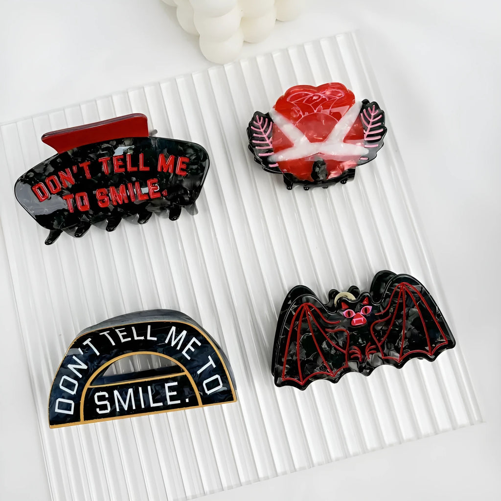Halloween hair clip with bat design in four style variations.