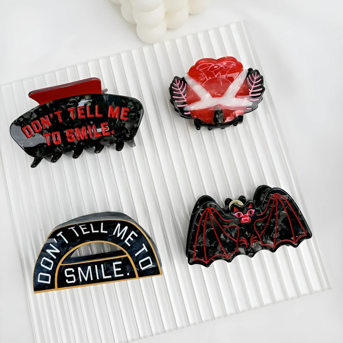 Halloween hair clip with bat design in four style variations.