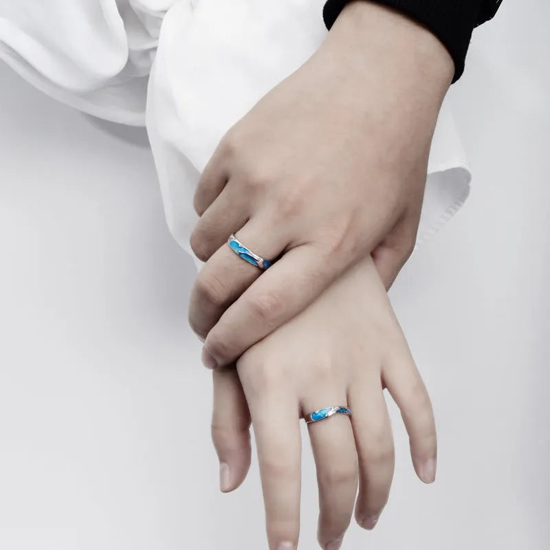 Silver adjustable couple ring with dolphin motif simple style on surface