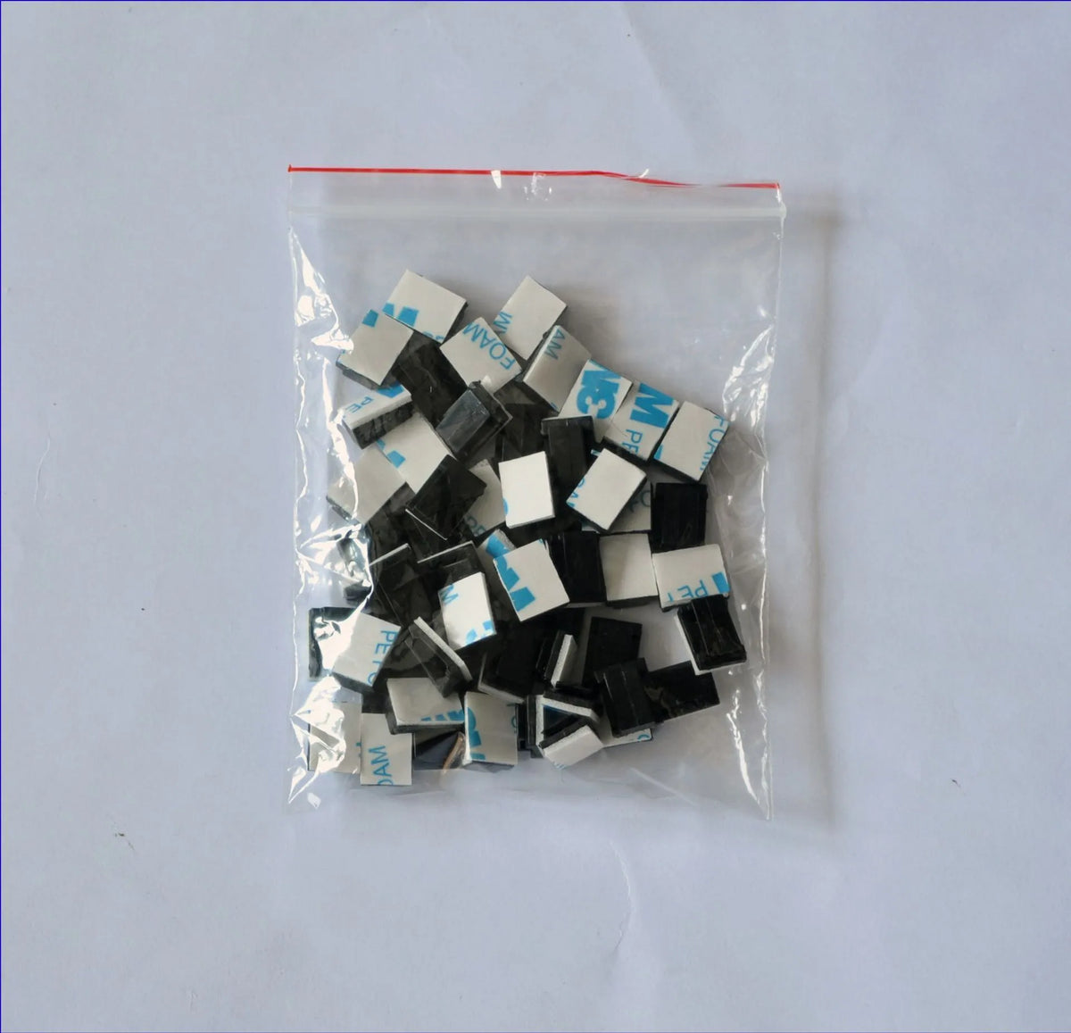 Black PA66 plastic wiring management clips for automotive and electronic cable organisation.