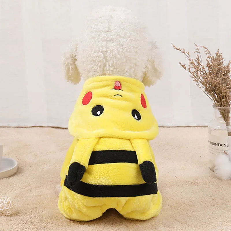 A small dog or cat wearing a soft fleece hoodie coat in a cosplay style.