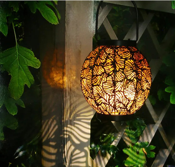 Hollow iron solar courtyard lamp with decorative design for outdoor garden lighting