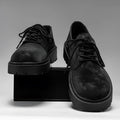 Men's black thick sole height increasing casual vulcanised shoes with buckle fastening and metal detail