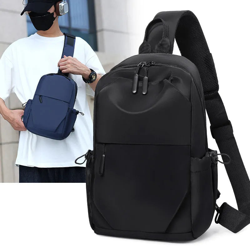 Grey mens chest bag showing shoulder strap and main compartment with waterproof exterior.