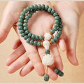 White jade bodhi green sandalwood bracelet with bead construction and double ring safety buckle