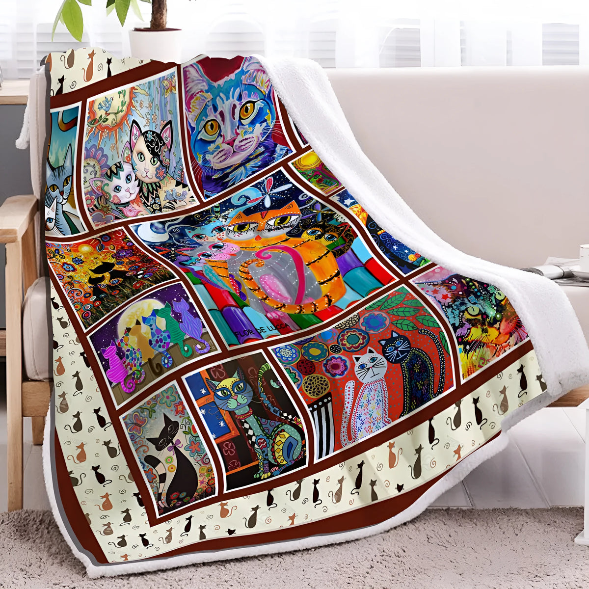 Multicoloured cat themed Sherpa fleece blanket 130x150cm with hemmed edges on a sofa