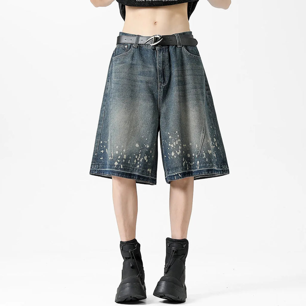 Men's retro blue denim shorts with ripped details and splash ink pattern