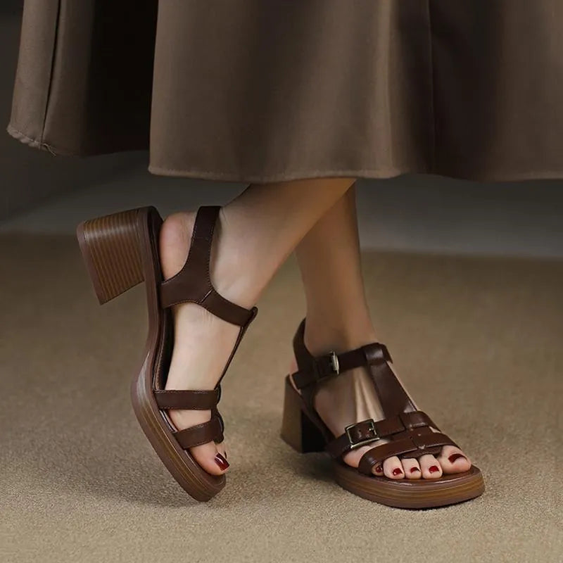 Women's black retro high heel sandals with a T-shaped buckle and chunky platform sole.