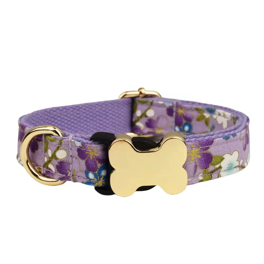 Flat nylon dog collar with a printed grid pattern and a white bone-shaped plastic buckle.