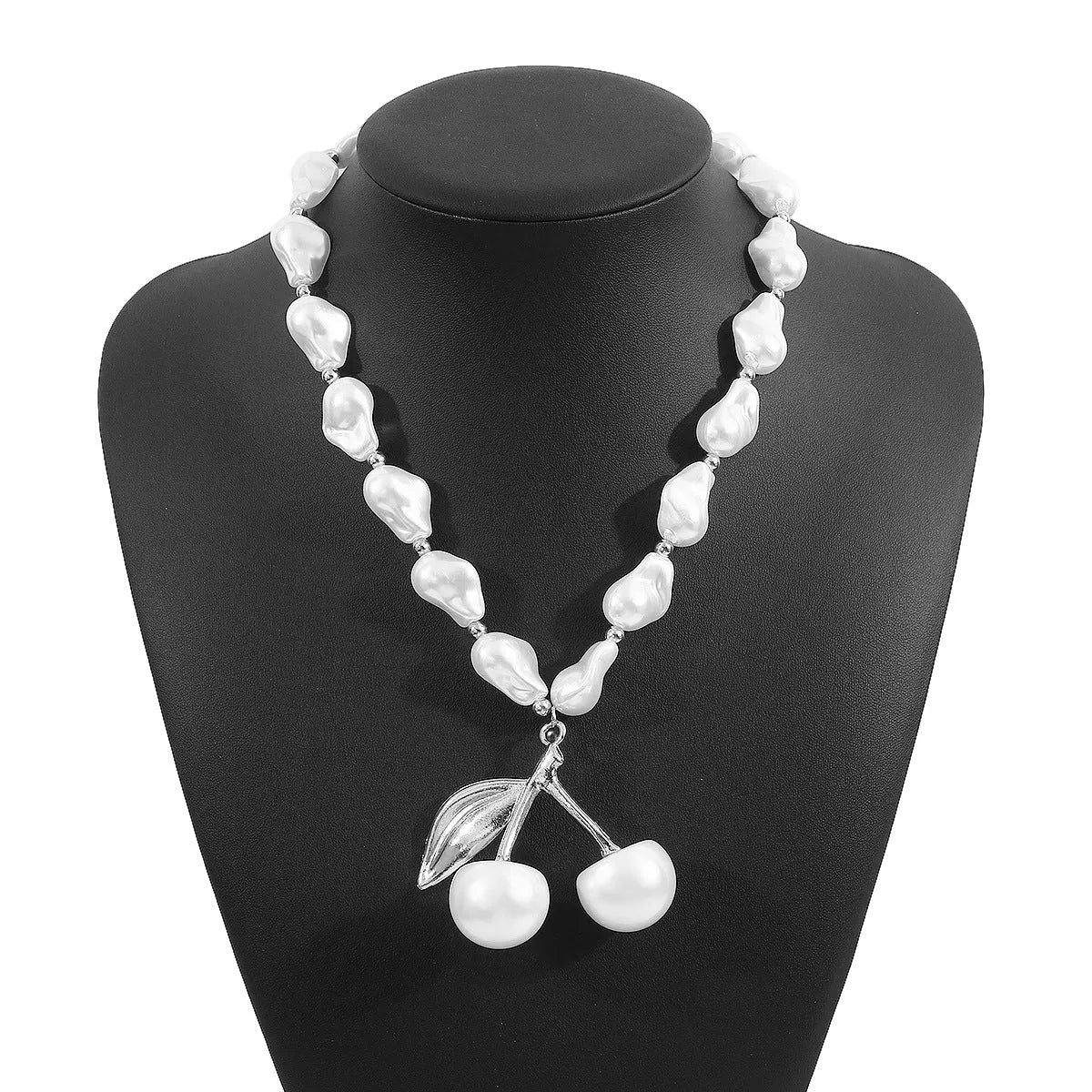 Gold and white K electroplated alloy necklace with irregular cherry fruit pendant and imitation pearls, adjustable chain.