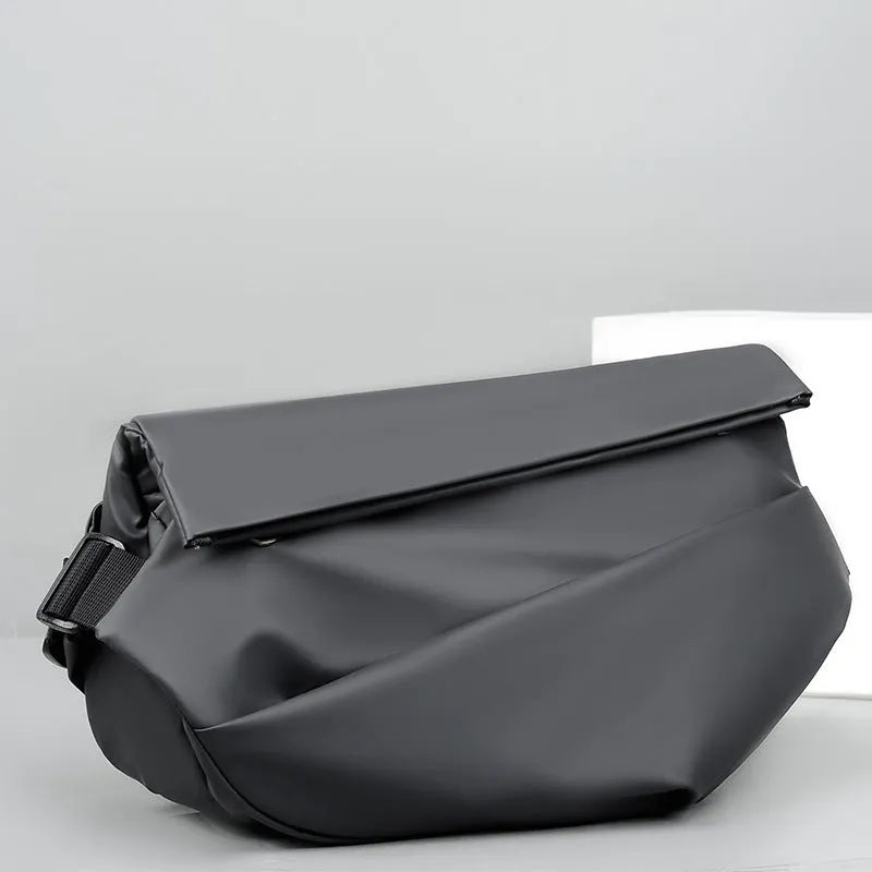 Grey men's medium crossbody bag with shoulder strap showing zipper opening and horizontal square shape