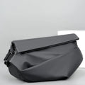 Grey men's medium crossbody bag with shoulder strap showing zipper opening and horizontal square shape