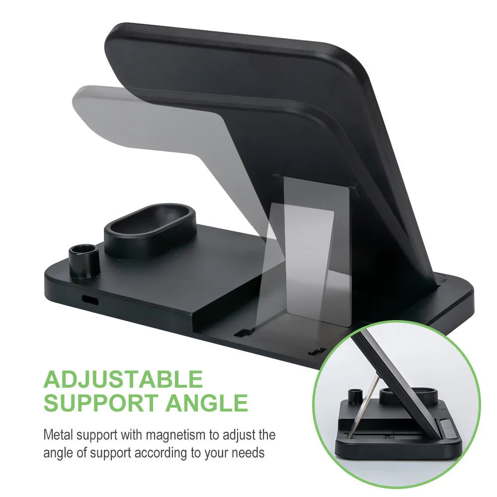 A folding 4-in-1 wireless charger in Space Gray, shown charging an iPhone in vertical stand mode and an Apple Pencil.