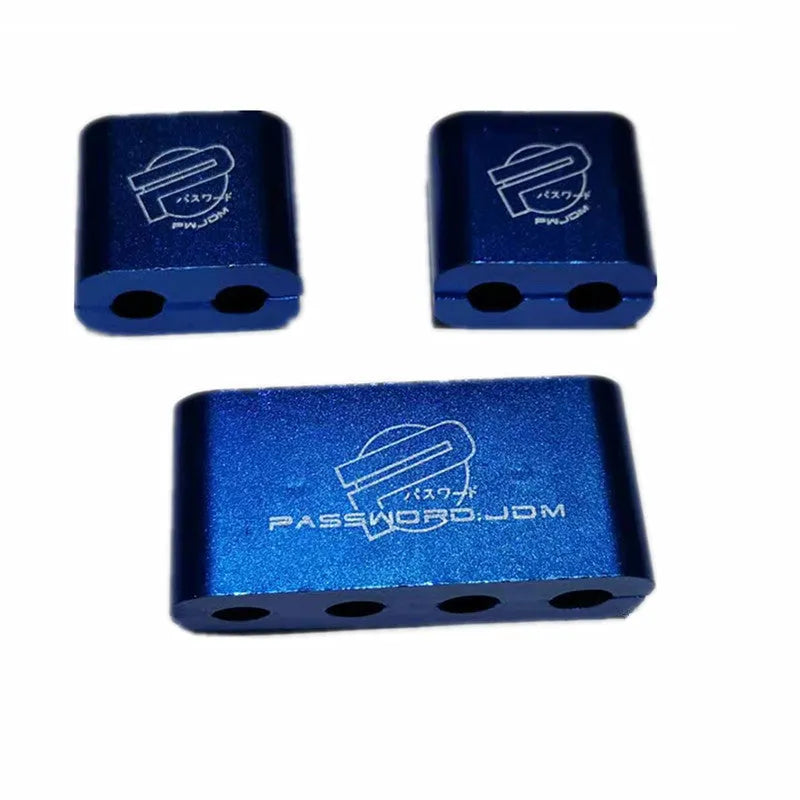 Three-piece metal car modification fastening clamp in assorted colours on a white background.