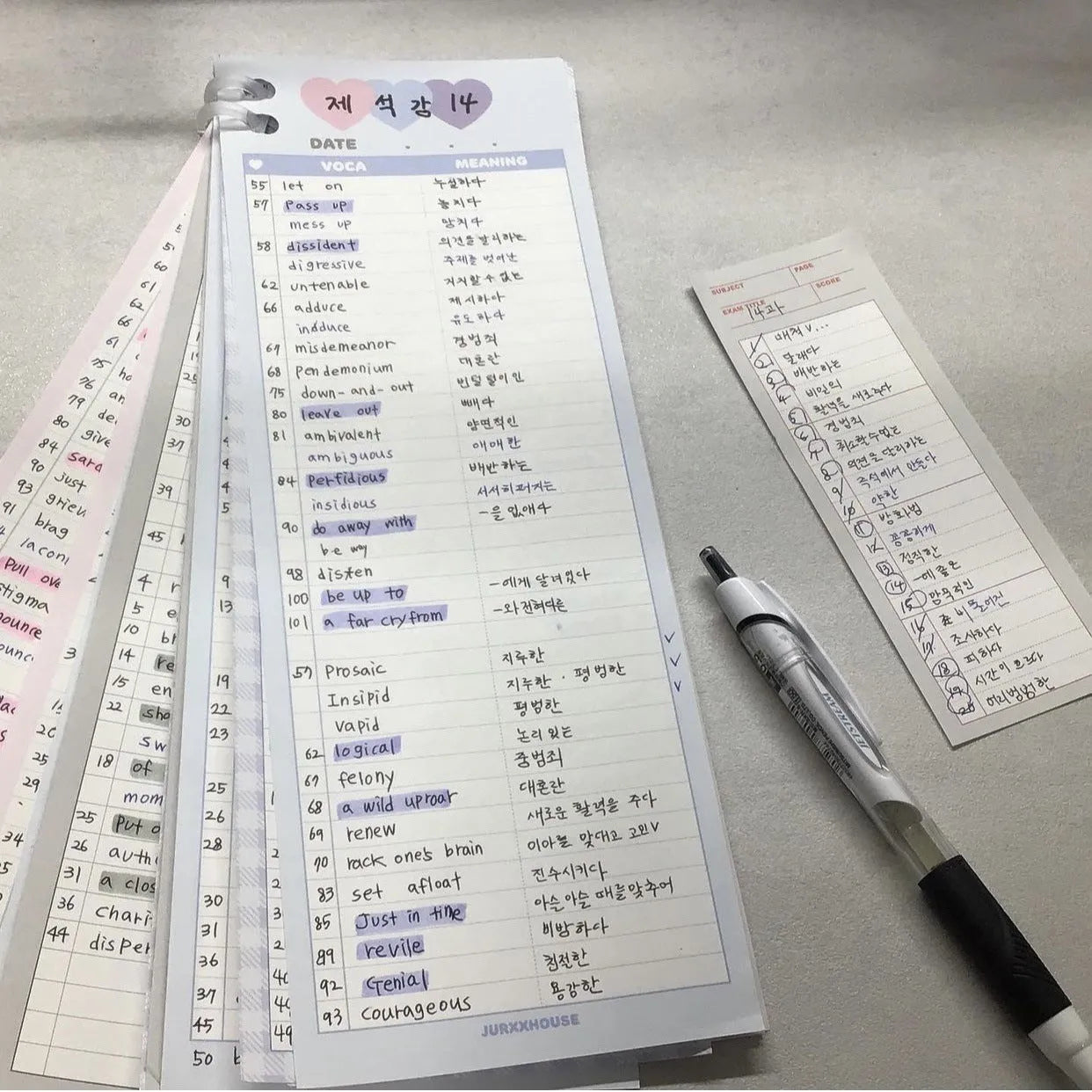 B5 half-size notepad with vertical English words printing in pink, purple, and blue cover colours.