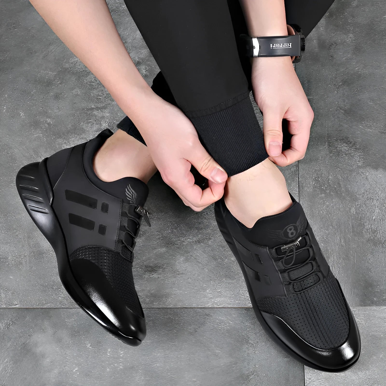 Men's black casual shoe with concealed height increase heel, available in leather, mesh, and Lycra materials.