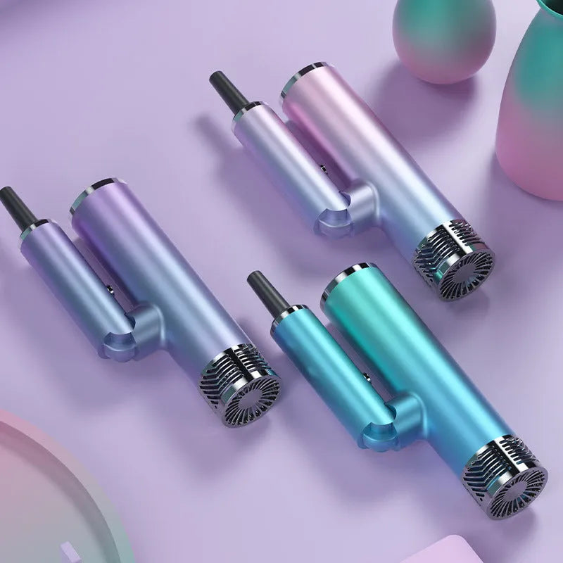 Green foldable hair dryer with collapsed handle beside extended purple model showing compact storage size
