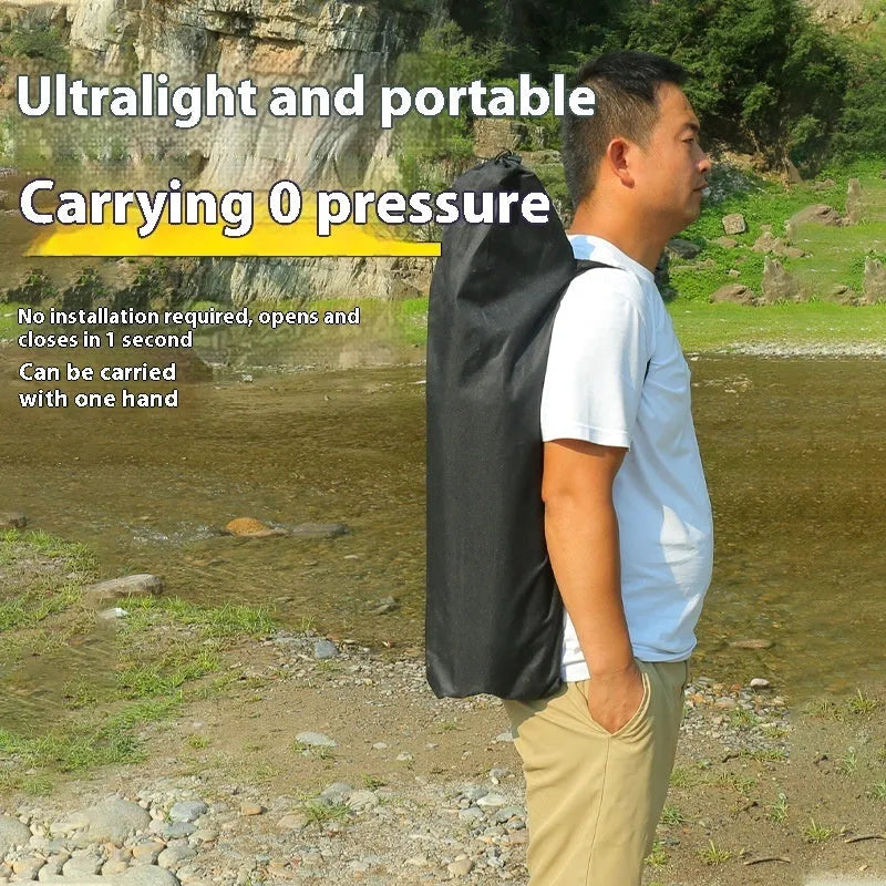 Beige portable folding camping chair with steel frame on grass outdoors