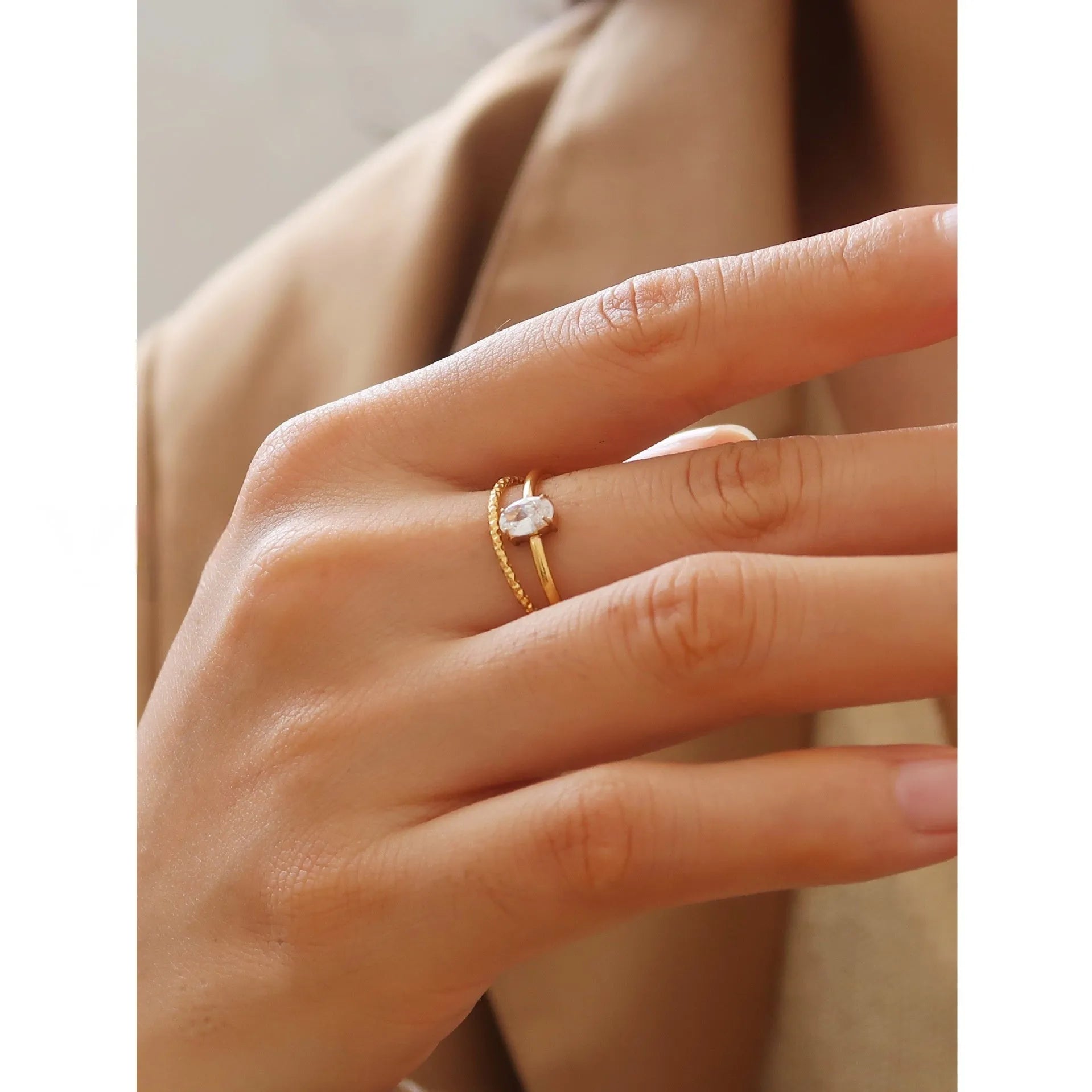 Simple golden stainless steel ring with either love heart or oval shape design in sizes 5 to 8