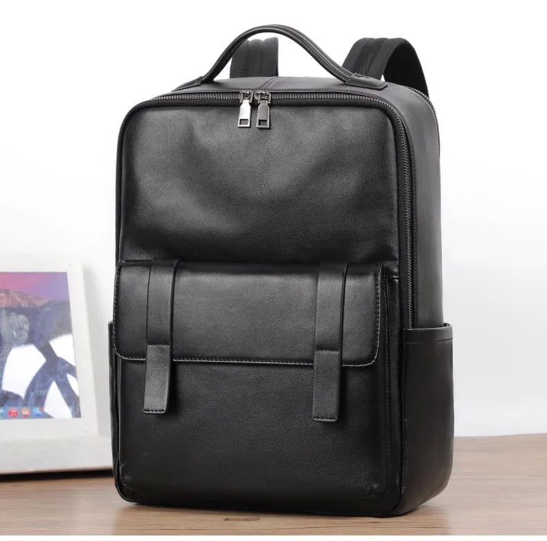 Men's black genuine leather large capacity laptop backpack with weave details.