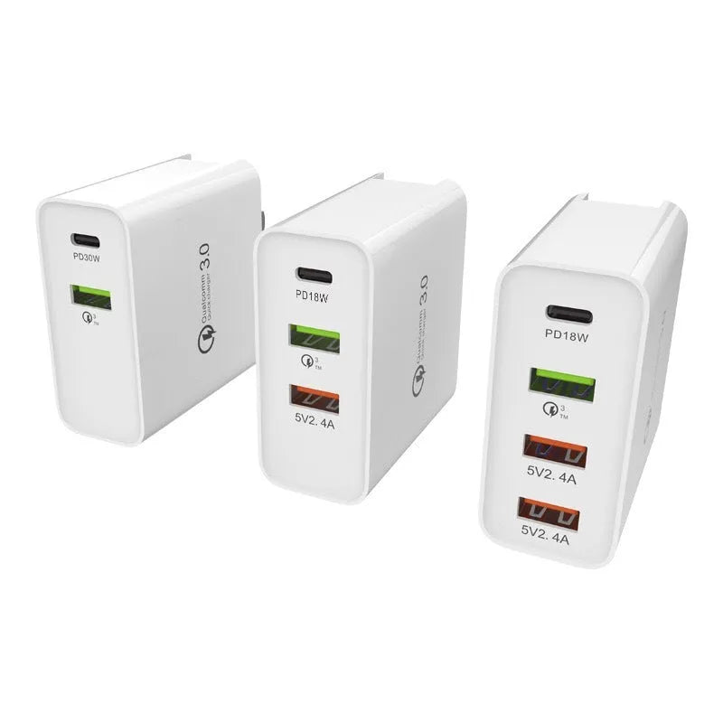 White 4-port USB fast wall charger with UK plug showing PD, QC and USB ports