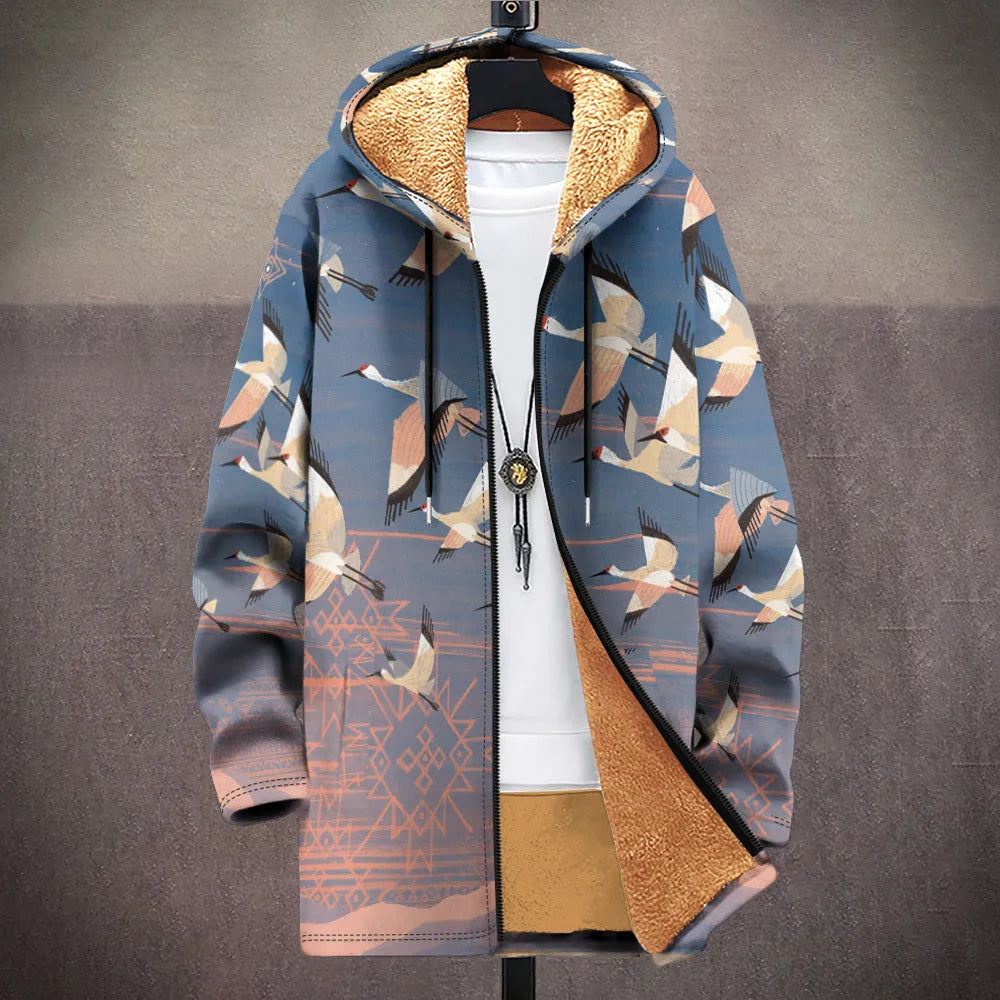 Man wearing a loose multicolour printed hooded cardigan with a front zip.