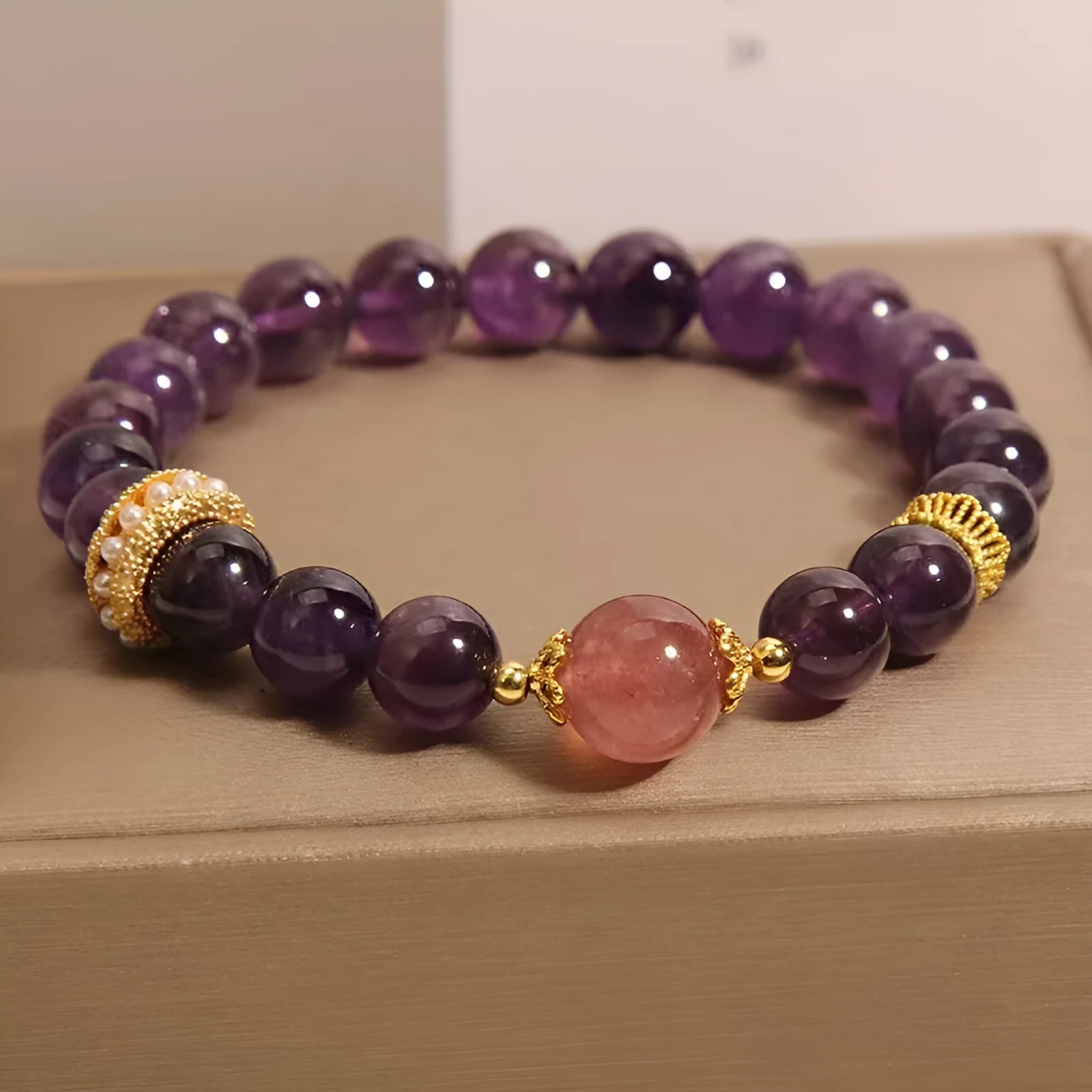 Women's natural amethyst and strawberry quartz bracelet with geometric garland design