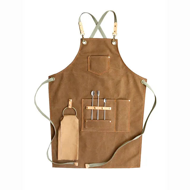 Canvas cross-strap apron in camel colour on hanger