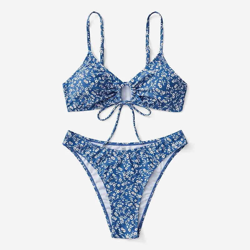 Blue women's swimsuit three-piece set with top and shorts, made from polyester fabric.