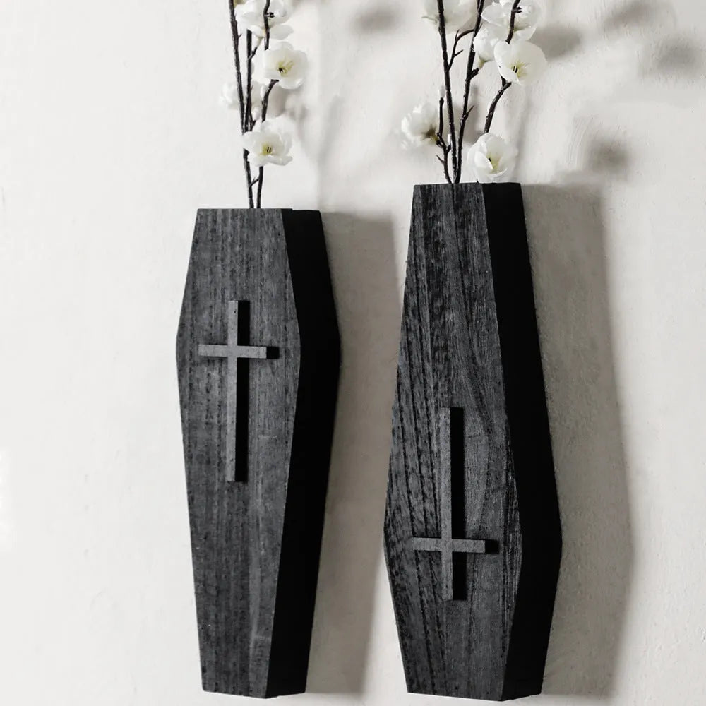 Black wooden cross-shaped wall shelf with dimensions 27cm by 9cm for displaying small decorative items.