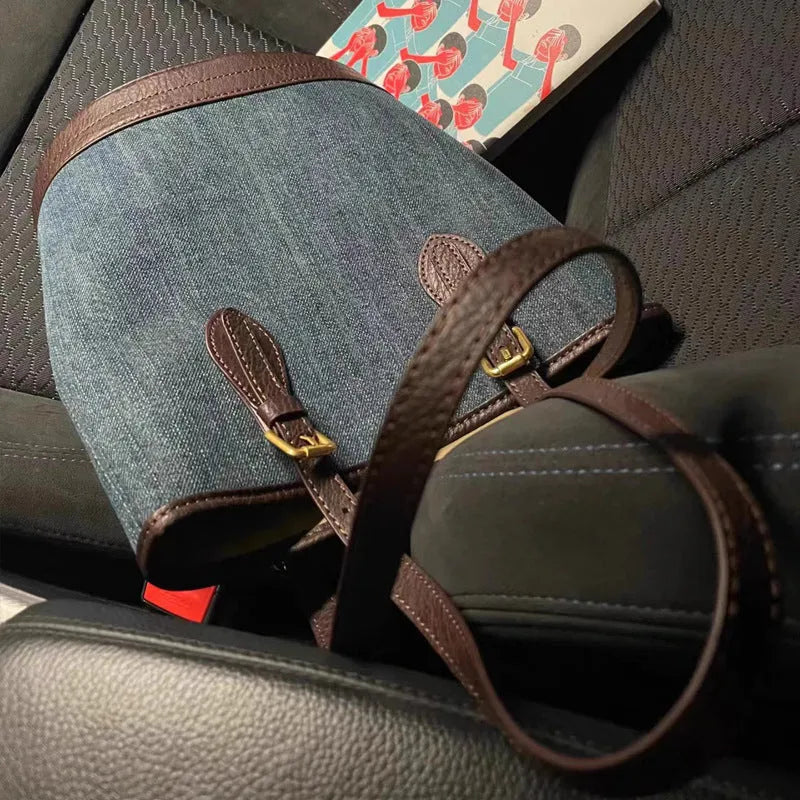 Denim patchwork polyester bucket handbag showing structured shape and one-shoulder strap