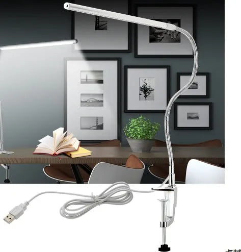 Silver LED clip-on table lamp with long arm extended, showing aluminium alloy construction and USB cable.