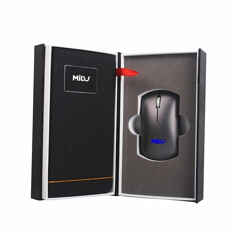 Folding cloth wireless charging mouse pad next to a small white wireless mouse on a desk