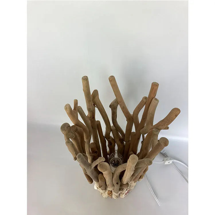 Driftwood decorative table lamp with wood colour finish and 24.5cm square base on a desk