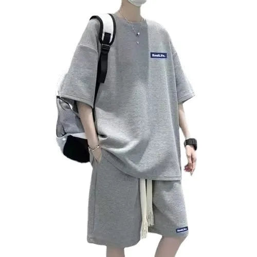 Waffle textured cotton polyester leisure sports suit set in blue, showing short sleeve top and shorts