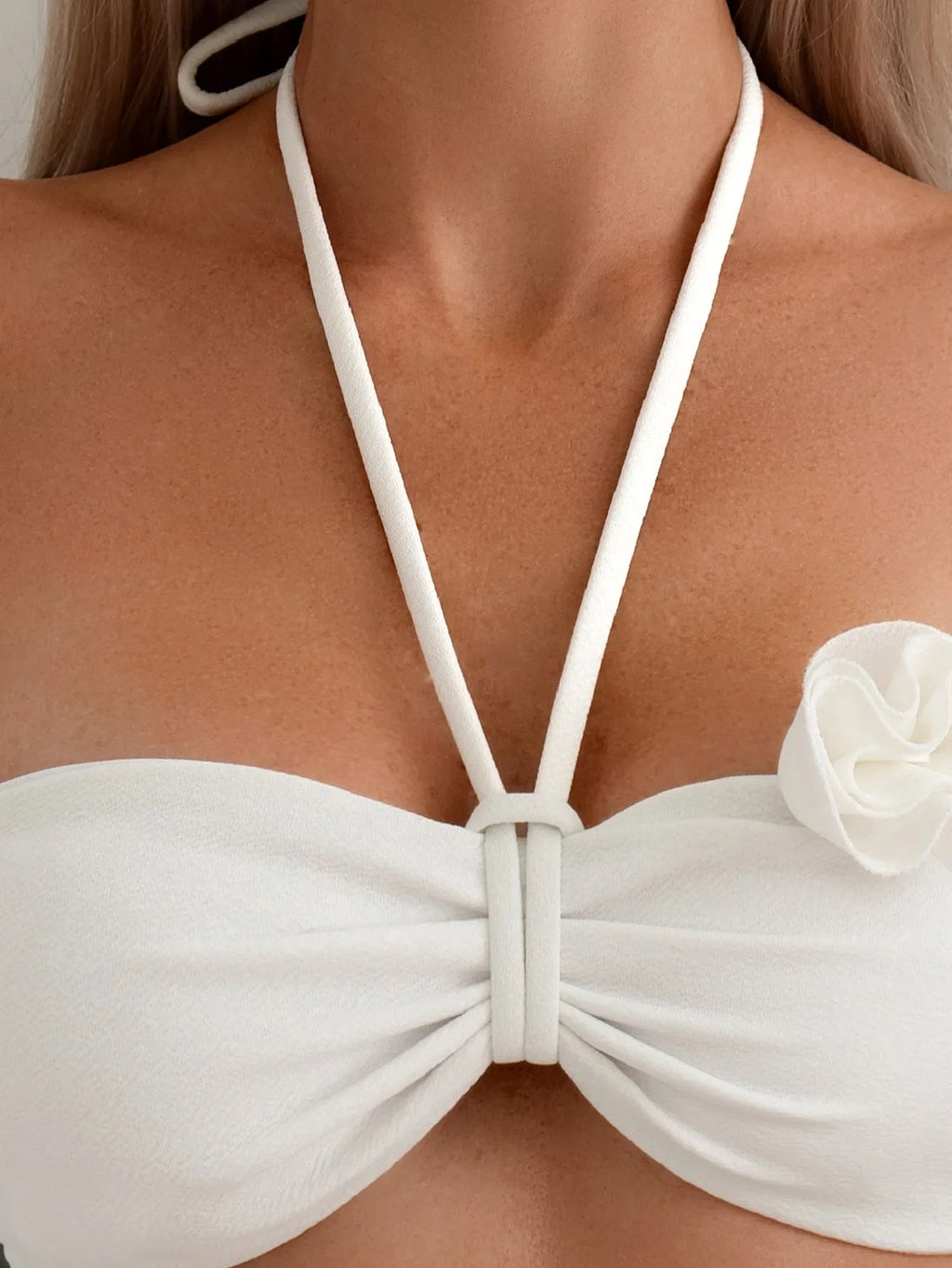 White split swimsuit with three-dimensional flower, halter lace-up neck, and briefs style, sizes S M L