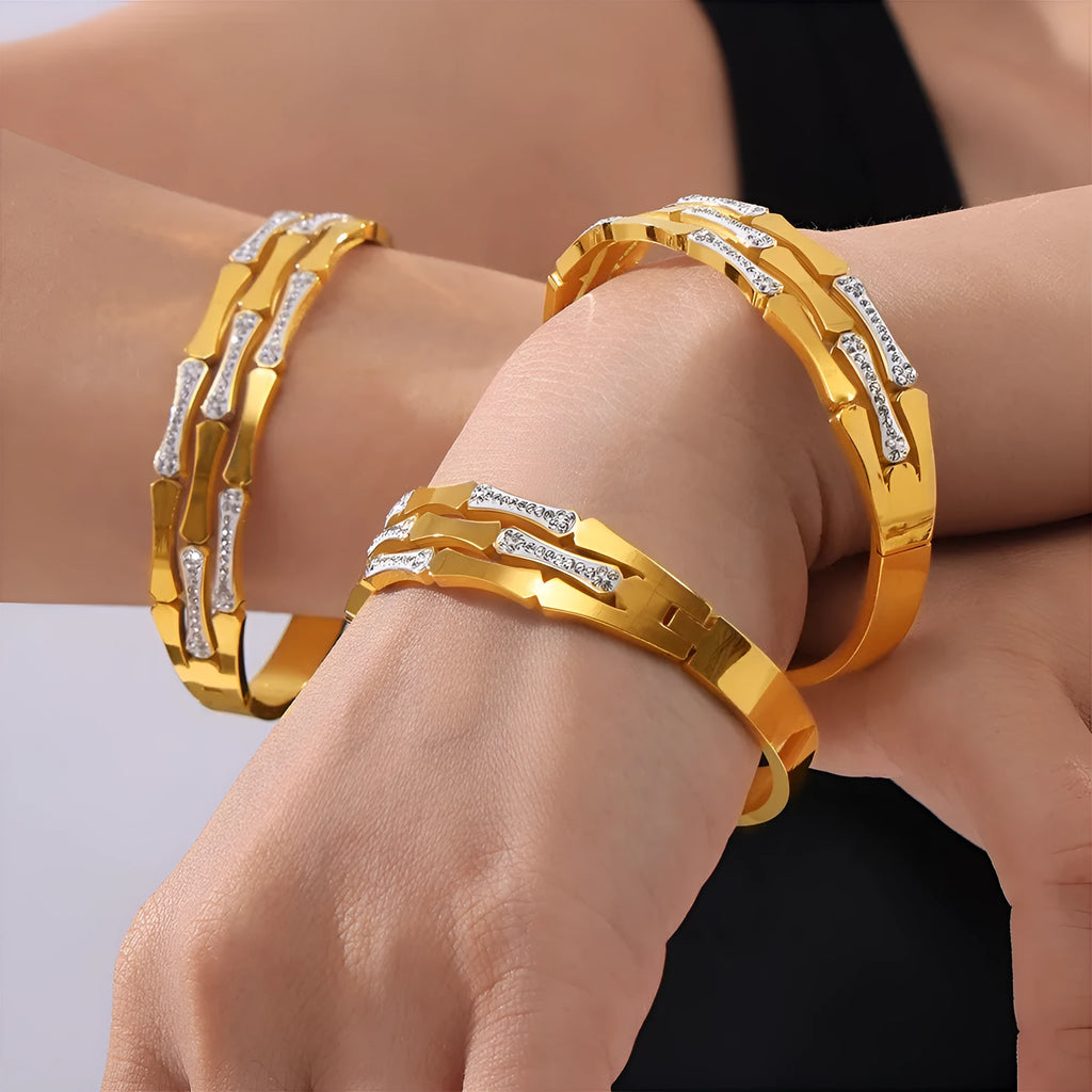 Gold electroplated titanium steel hollow splicing casual bracelet for women, open cuff design on white background