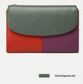 Women's short wallet with soft leather texture, solid colour design, stitching detail, and polyester lining, shown in one of nine colours.