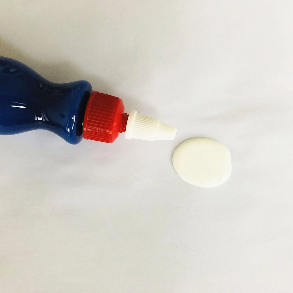 Small blue car wiping tool with scratch repair agent bottle for automotive paintwork touch-up applications