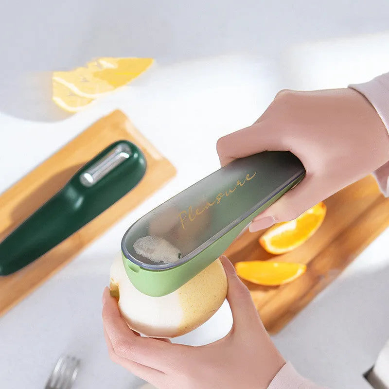 Green kitchen peeler with stainless steel blade stored inside a clear plastic tube.