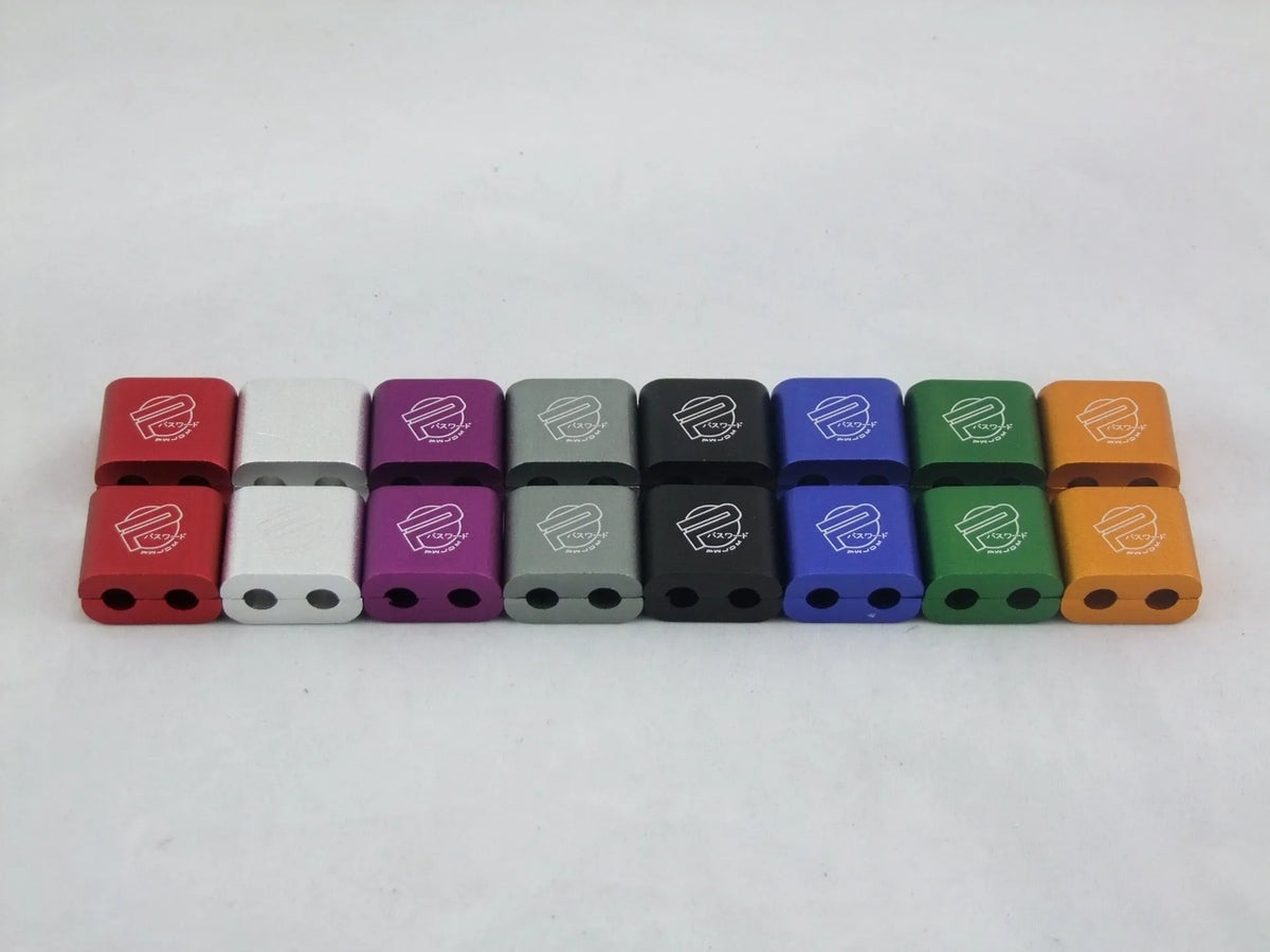 Three-piece metal car modification fastening clamp in assorted colours on a white background.