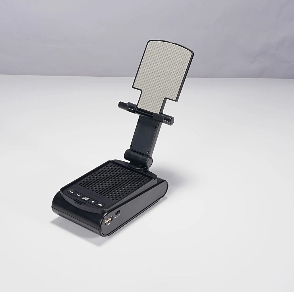 Multi-function lazy phone holder with Bluetooth audio in black plastic on a desk showing a smartphone in landscape mode