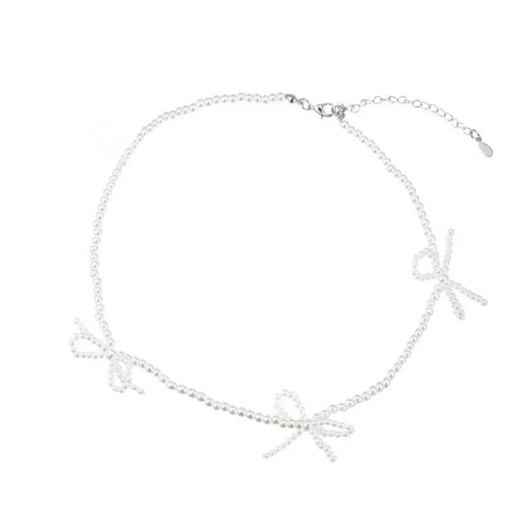 White imitation pearl necklace with bow pendant on adjustable 31-40cm chain