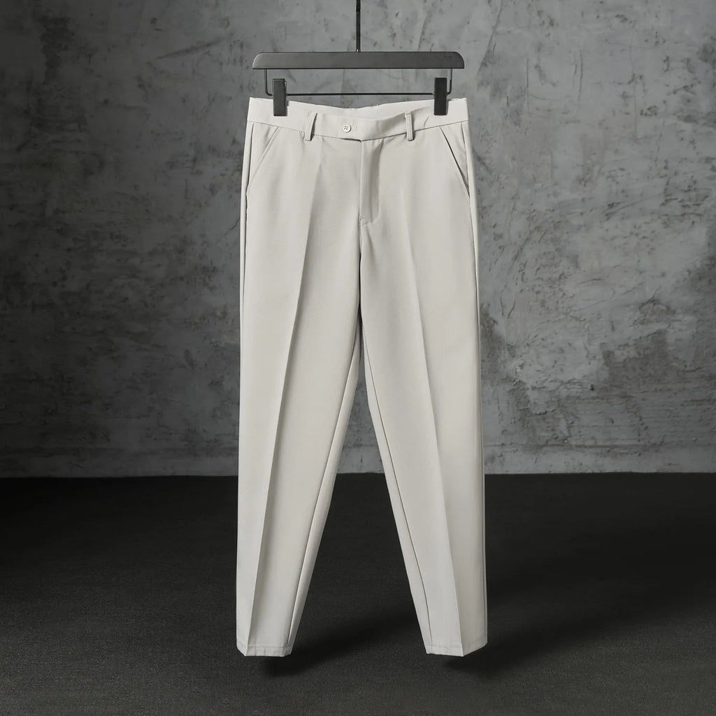 Men's straight loose trousers in light gray brushed polyester, front view showing straight cut and elastic waist