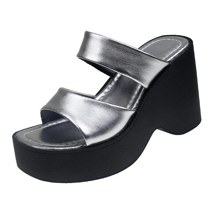 Women's black wedge platform slippers with square toe design on grey background